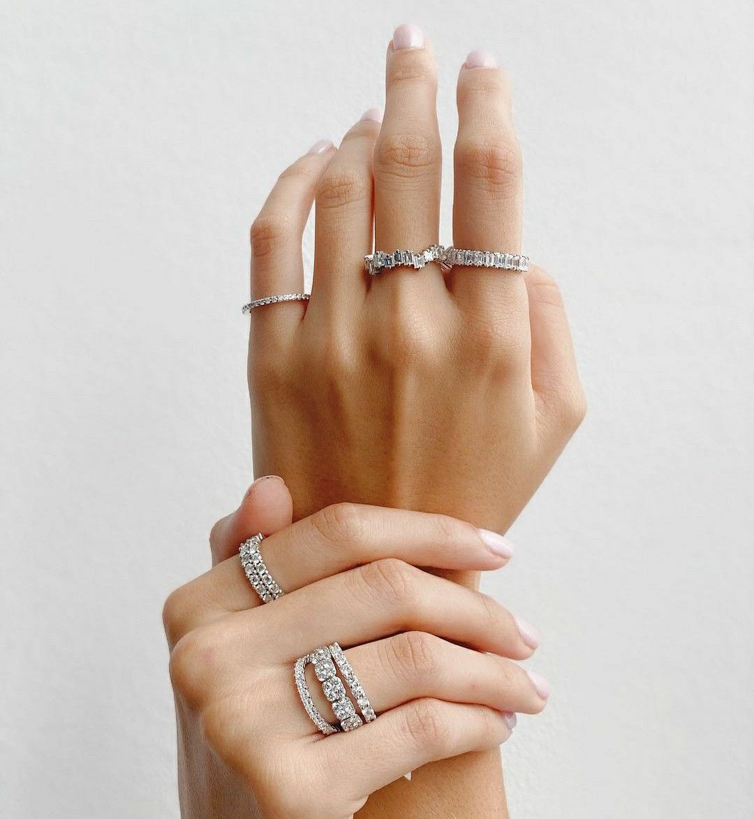 Diamond rings worn in a layered stack