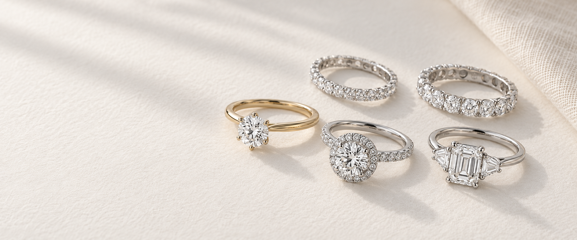 A collection of solitaire, halo, three-stone and eternity rings
